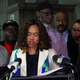 Baltimore State’s Attorney Marilyn Mosby, center, flanked by Andrew Steward, left, Ransom Watkins (behind Mosby) and Alfred Chestnut (green jacket).